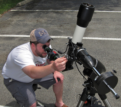 visitor observing through our DayStar Quantum filter on TeleVue 85 telescope on a Solar Saturday event at Company Seven (126,533 bytes)