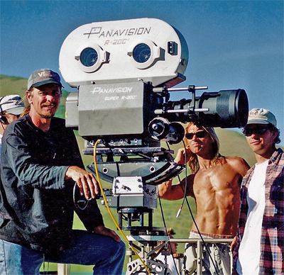 cinematographer Don FauntLeRoy with his Nikkor 300mm F/2 ED IF lens on location near San Diego in 1992 (51,883 bytes)