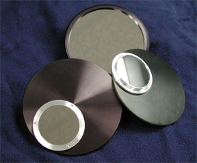 Three of the better metal coated glass solar filters in cells. Shown are two Off-Axis and one Full Aperture Filter in their machined cells. (63,163 bytes).
